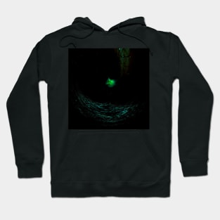 Digital collage and special processing. Dark place. Dark water. Something glows there. Hoodie